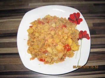 Bratkartoffeln mit Paprika und Schinkenwürfeln - Rezept
