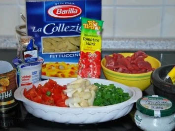 Papardelle in tomatisiertem Pilz-Safranrahm und Rinderstreifen - Rezept - Bild Nr. 2