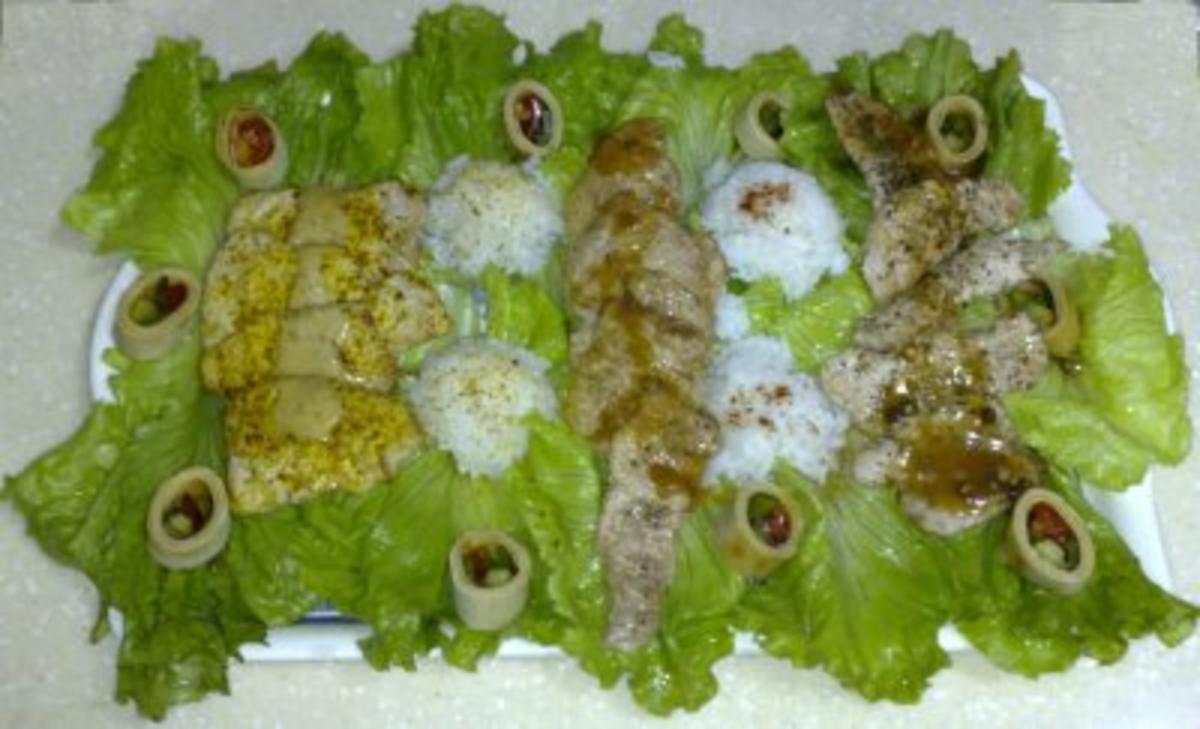 Trilogie aus Schweinefilet auf Salatbett an Reiskugeln - Rezept