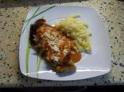Schweineschnitzel "Mailand" paniert, mit Käse garniert - Rezept