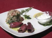 In Rotwein gebratene Tintenfische im Kräutersud, dazu Reis mit Spinat - Rezept