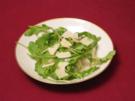 Rucola in Vinaigrette mit Birne und Parmesan - Rezept