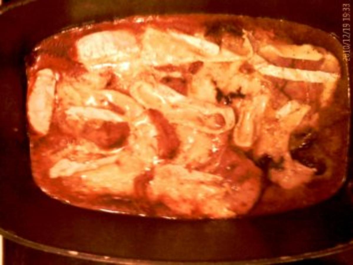 Überbackene Kalbsschnitzel in Tomatensoße - Rezept