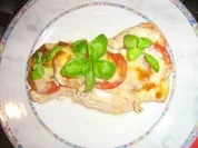 Putenschnitzelchen unter einer Tomaten-Mozzarella-Kruste - Rezept