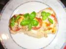 Putenschnitzelchen unter einer Tomaten-Mozzarella-Kruste - Rezept