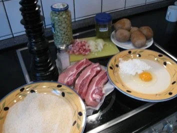 Dicke Rippe paniert , dazu Salzkartoffeln und Bohnen mit Speck in Bechamelsauce - Rezept