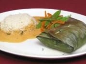 Pangasiusfilet auf Karotten-Ingwer-Bett im Bananenblatt mit Reis und Zuckerschoten - Rezept