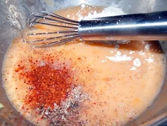 Hähnchenbrust in Kardamom-Parmesan-Hülle auf Tomatensauce und Reis - Rezept - Bild Nr. 3