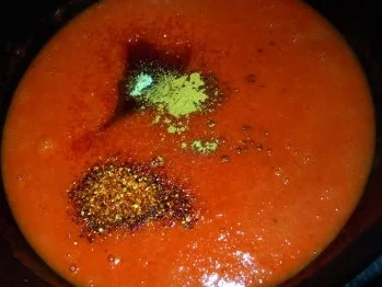 Hähnchenbrust in Kardamom-Parmesan-Hülle auf Tomatensauce und Reis - Rezept - Bild Nr. 7