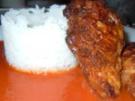 Hähnchenbrust in Kardamom-Parmesan-Hülle auf Tomatensauce und Reis - Rezept