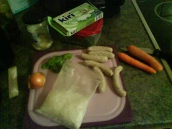 Nürnberger & Möhrchen in Kräutersahne auf Reisbett - Rezept - Bild Nr. 3