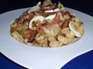 Nudelsalat mit gebratenen Schinkenstreifen- Champignons - Rezept
