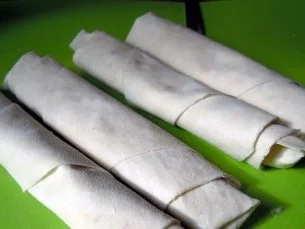 Hähnchenbrust in Tomaten-Orangensud mit Tagiatelle und Ziegenkäse-Zigarren - Rezept - Bild Nr. 3