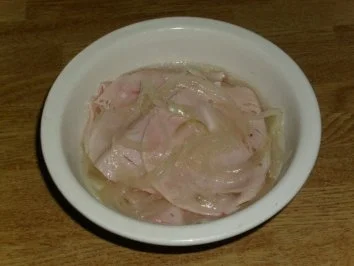 Putenkasseler Zwiebelfleisch - Rezept