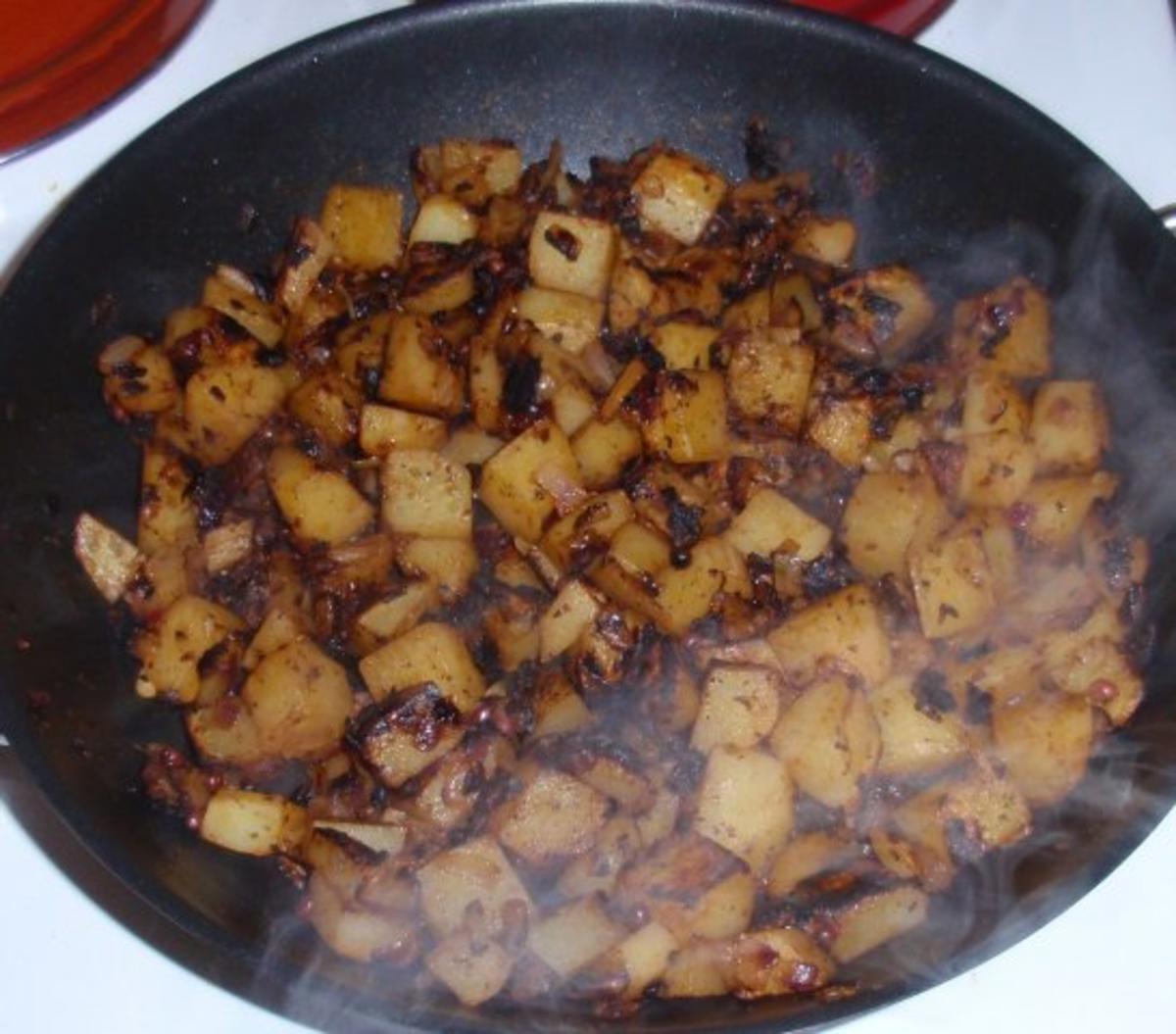 Pangasiusfilet auf Gemüse-Zwiebelbett und Bratkartoffeln - Rezept - Bild Nr. 12