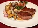 Rezept: Hirschsteak Schweizer Art, dazu Bohnen im Speckmantel und Rosmarinkartoffeln Hirschsteak Schweizer Art, dazu Bohnen im Speckmantel und Rosmarinkartoffeln - Rezept