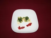 Zucchiniröllchen mit Büffelmozzarella und Parmaschinken in Parmesankräuterkruste - Rezept