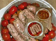 Schweinswürste an Tomaten - Rezept