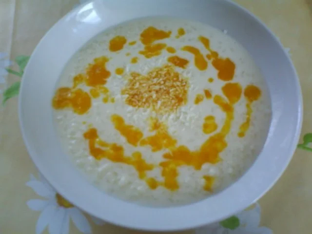 Kokosmilchreis mit beschwipster Orangen-Mangosoße - Rezept