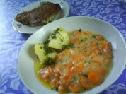 Kotelett's in knuspriger Nusspanade mit Kräuterkäsefüllung und Petersilienkartoffeln - Rezept