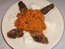 Cevapcici mit Tomaten-Erbsen-Reis - Rezept