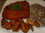 Rezept: Schnitzel mit Ofenkartoffeln und Champignons in einer Walnusscreme Schnitzel mit Ofenkartoffeln und Champignons in einer Walnusscreme - Rezept