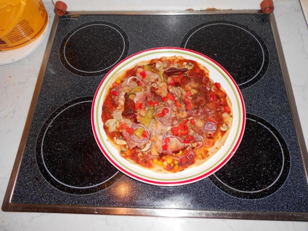 Pizzateig für ein Blech oder 2 runde Pizzen - Rezept - Bild Nr. 11