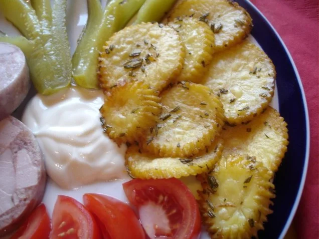 Rezept: Rosmarin-Kartoffelblüten mit Sülze Rosmarin-Kartoffelblüten mit Sülze - Rezept