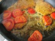Kotelett mit gebratenen Tomaten und Spiegelei - Rezept