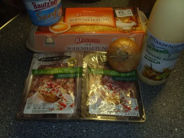 Rezept: Eier in einer Senf-Schinken-Kräuter-Zwiebelsosse Bild Nr. 2 Eier in einer Senf-Schinken-Kräuter-Zwiebelsosse - Rezept - Bild Nr. 2