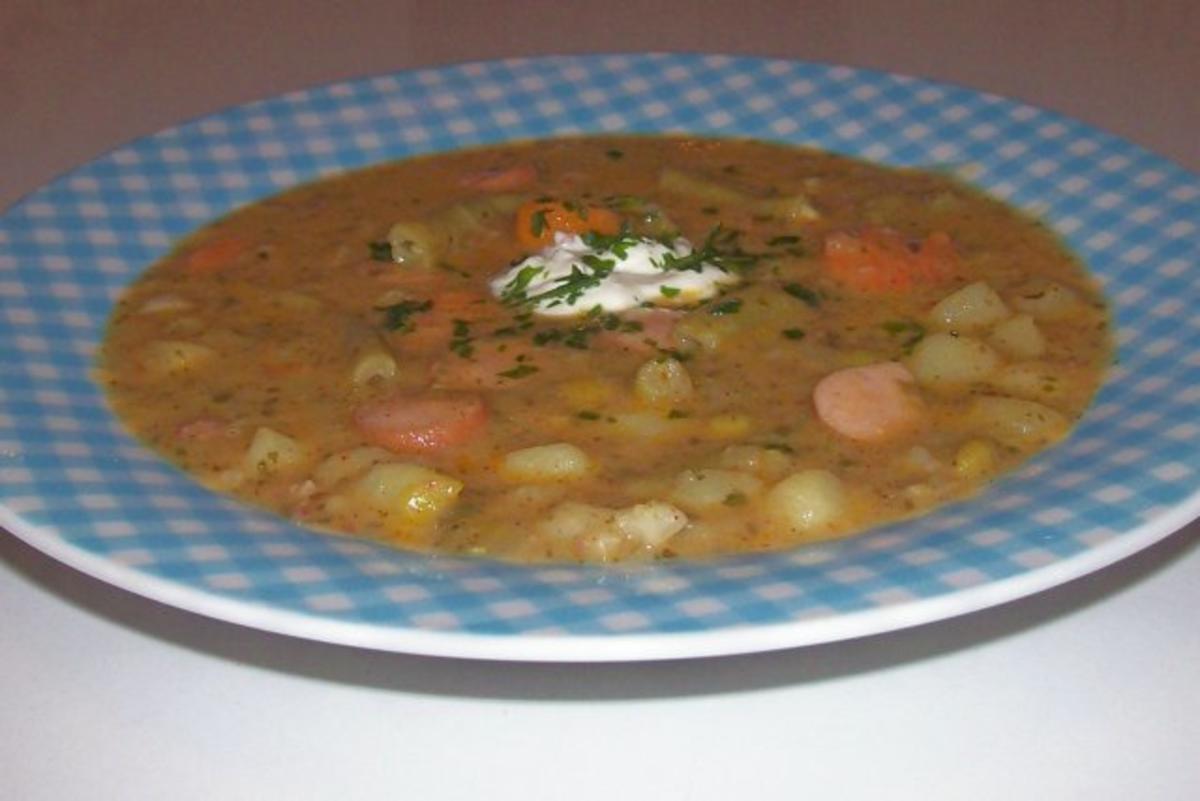 Bunter Gemüseeintopf mit Würstchen und Speck - Rezept - kochbar.de