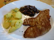 Kalbsschnitzel mit einem schwarzen Gemüse - Rezept