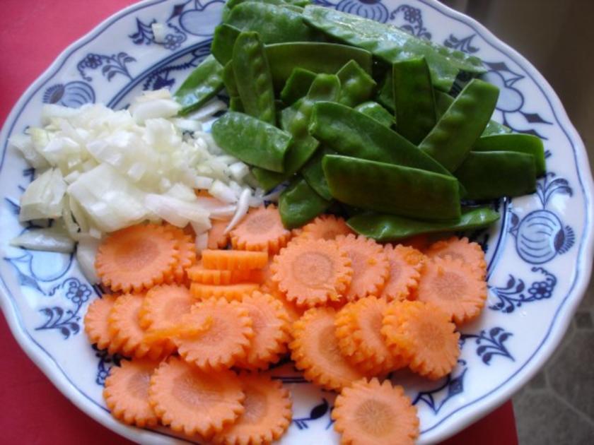 Zuckererbsen mit Möhrenblüten - Rezept - kochbar.de