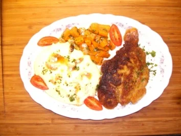 Paniertes Nackensteak mit Möhrengemüse - Rezept