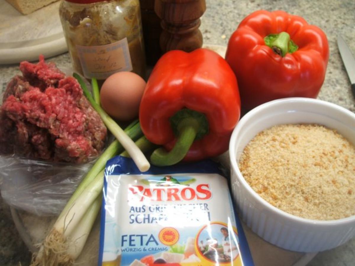 Fleisch: Gefüllte Paprikaschoten auf Tomatensoße und Reis - Rezept - Bild Nr. 2
