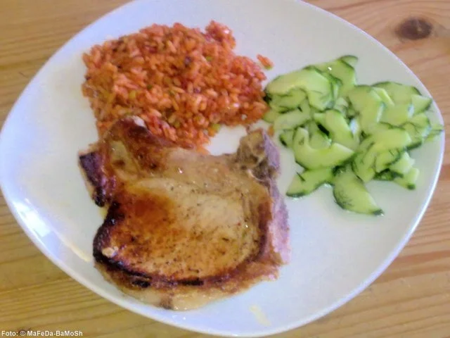 Kotelett mit Tomatenreis - Rezept