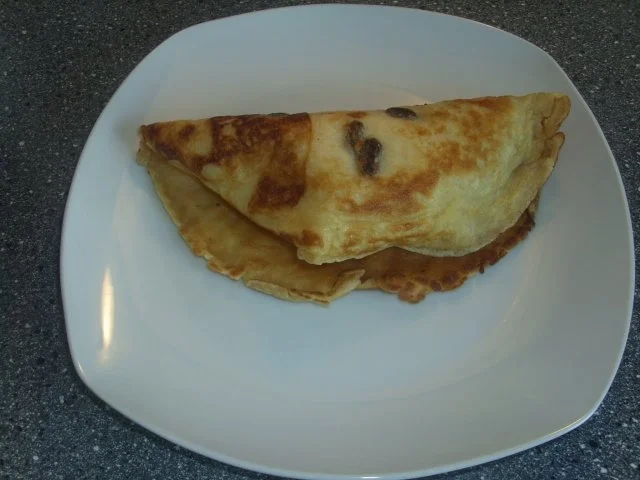 Rezept: Rosinen-Eierkuchen mit Eis und Schokososse Bild Nr. 7 Rosinen-Eierkuchen mit Eis und Schokososse - Rezept - Bild Nr. 7