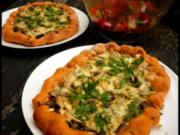 Zucchini-Pilz-Pizza mit Käserand - Rezept