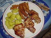 Schnitzel und  Kohlrabipommes mit Petersielkartoffeln - Rezept