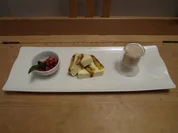 Tiramisu-Terrine auf marinierten Waldfrüchten und Bananen-Frappé - Rezept
