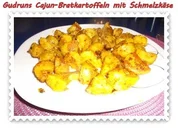 Kartoffeln: Cajun-Bratkartoffeln mit Schmelzkäse - Rezept