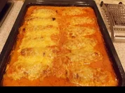 Schinken-Hack-Röllchen in cremiger Tomatensoße - Rezept