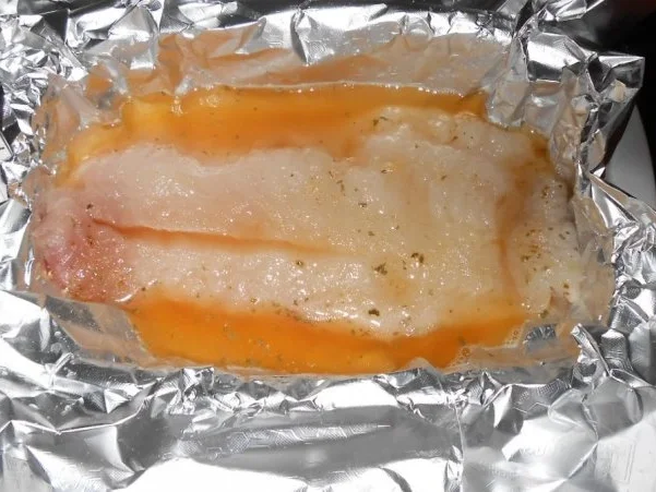 Rotbarschfilet aus dem Ofen mit pikanten Kartoffelspalten - Rezept - Bild Nr. 4