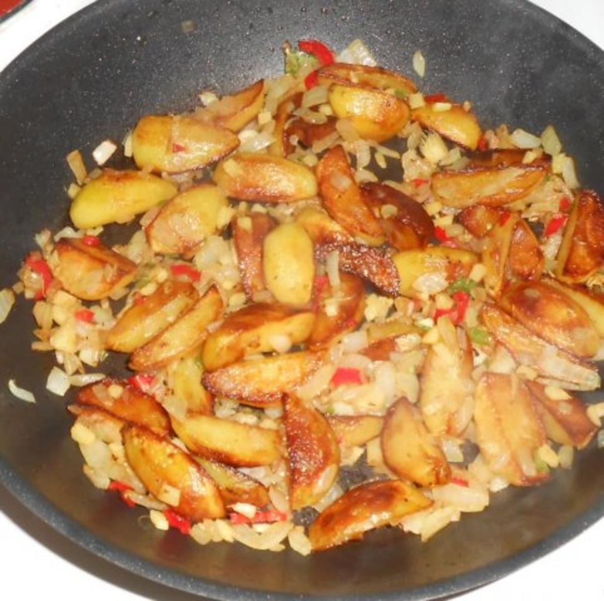 Rotbarschfilet aus dem Ofen mit pikanten Kartoffelspalten - Rezept - Bild Nr. 9