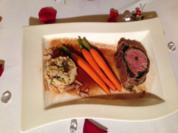 Kalbsfilet in Schinken-Kräuter-Mantel an Trüffel-Steinpilz-Risotto und Heidemöhrchen - Rezept