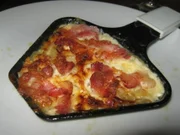 Zwiebeln mit Speck-Käse-Haube - Rezept