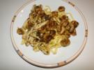 Garnelen und Tintenfischringe, gebraten in Knoblauch-Kräuter-Butter-Sauce - Rezept