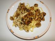 Garnelen und Tintenfischringe, gebraten in Knoblauch-Kräuter-Butter-Sauce - Rezept