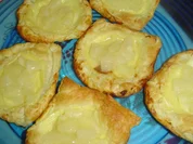 Blätterteigtaschenmit Pudding und Ananas - Rezept