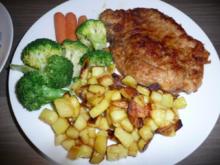 Kammkotelett an Bratkartoffeln, Broccoli und Mini - Karotten. - Rezept